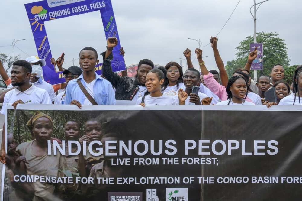 Protesters marched in Kinshasa under banners bearing slogans such as 'No to new fossil fuels'