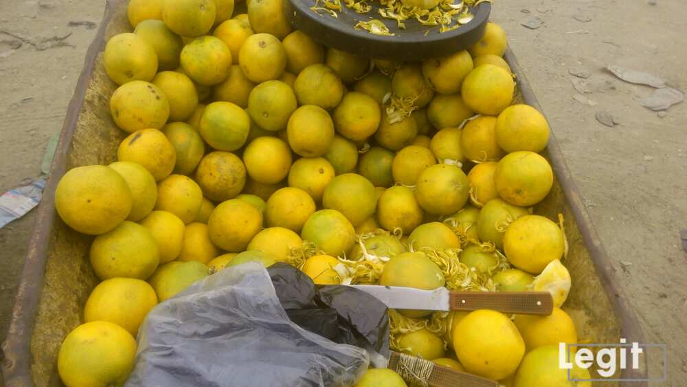 Oranges on display in Wheel Barrow along the road at a popular market in Lagos. Photo credit: Esther Odili