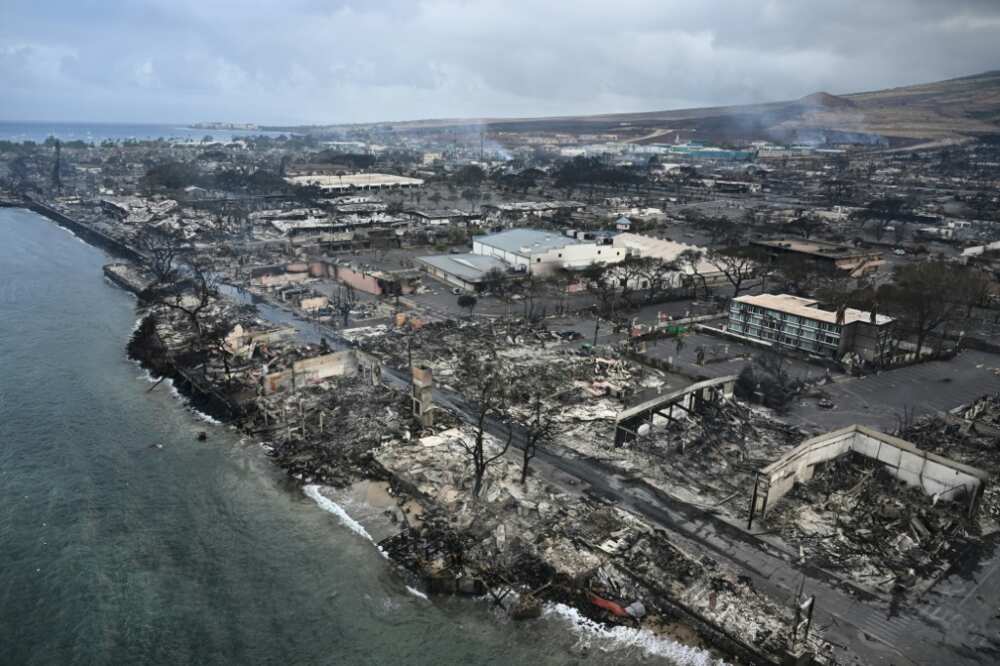 An aerial image shows destroyed homes and businesses along Front Street in Lahaina in the aftermath of wildfires in western Maui, Hawaii on August 10, 2023