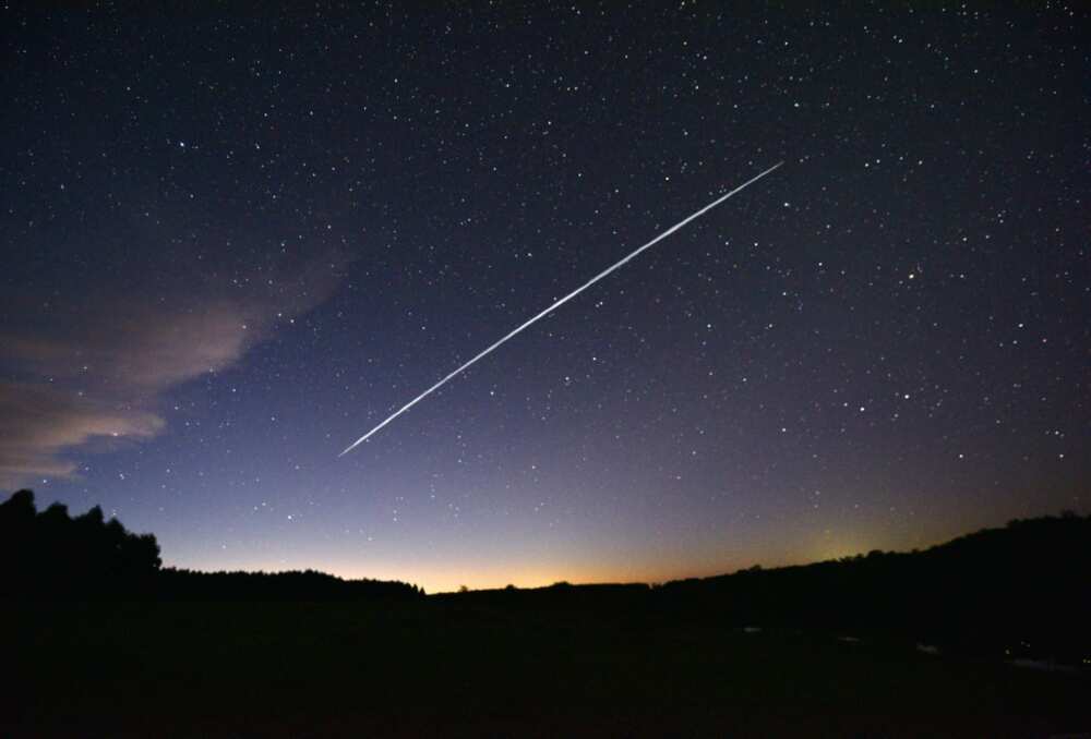 A long-exposure image of a group of SpaceX's Starlink satellites