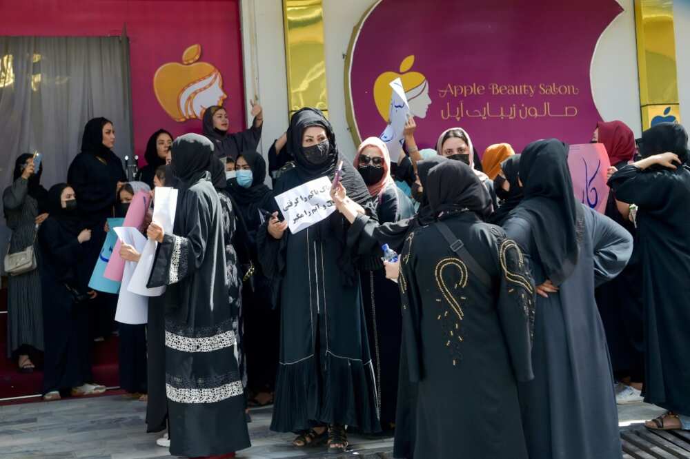 Afghan women stage a protest for their rights at a beauty salon in the Shahr-e-Naw area of Kabul on July 19
