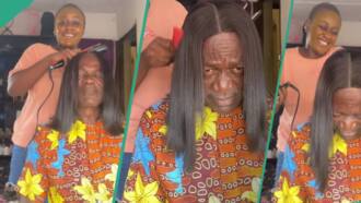 "He's tired of me": Nigerian girl uses father as mannequin while straightening her wig, video trends