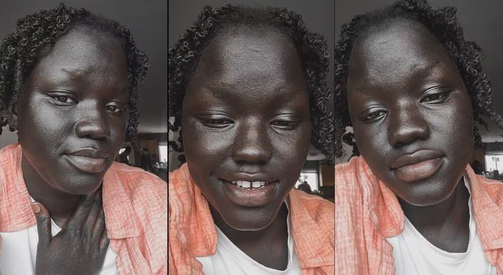 Photos of a lady who is endowed with a dark skin.
