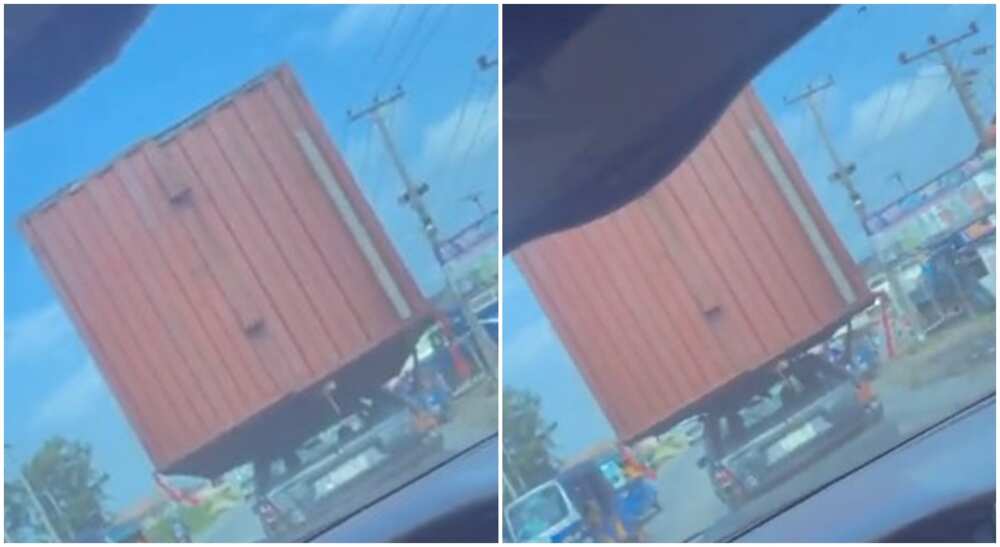 Small car carries container in Nigeria.