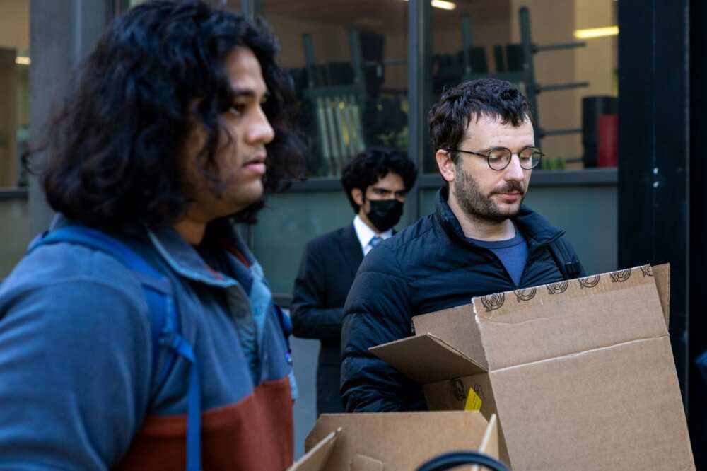 Rahul Ligma(L), software engineer, and Daniel Johnson speak with the media outside Twitter headquarters after allegedly being laid off on October 28, 2022, in San Francisco, California