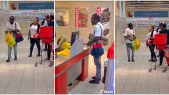 Husband material: Nigerian man spotted shopping at Ibadan mall with a baby on his back, video causes stir