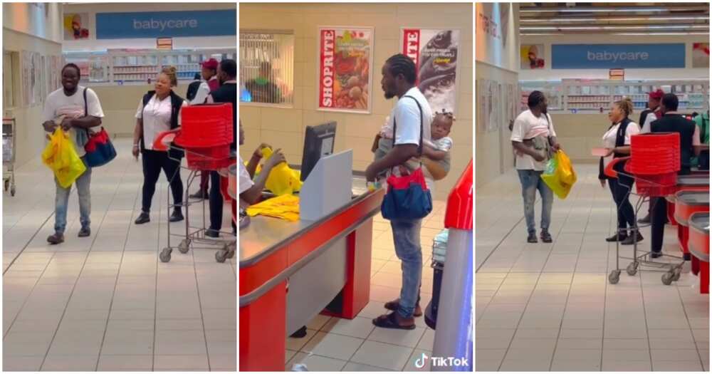 Husband material, man shops with bay on his back, man back carries baby, Ibadan mall