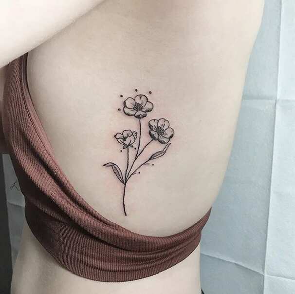 Wild rose daisy and buttercups tattoo  Tattoogridnet