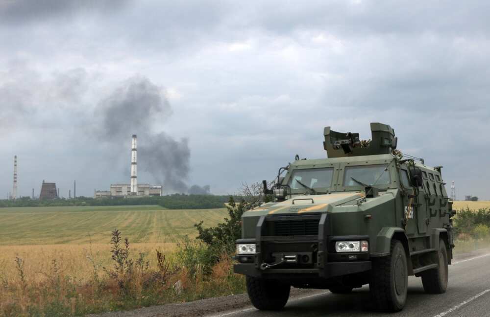 The road between Siversk and Bakhmut was busy with armoured personnel carriers, jeeps and ambulances The road between Siversk and Bakhmut was busy with armoured personnel carriers, jeeps and ambulances