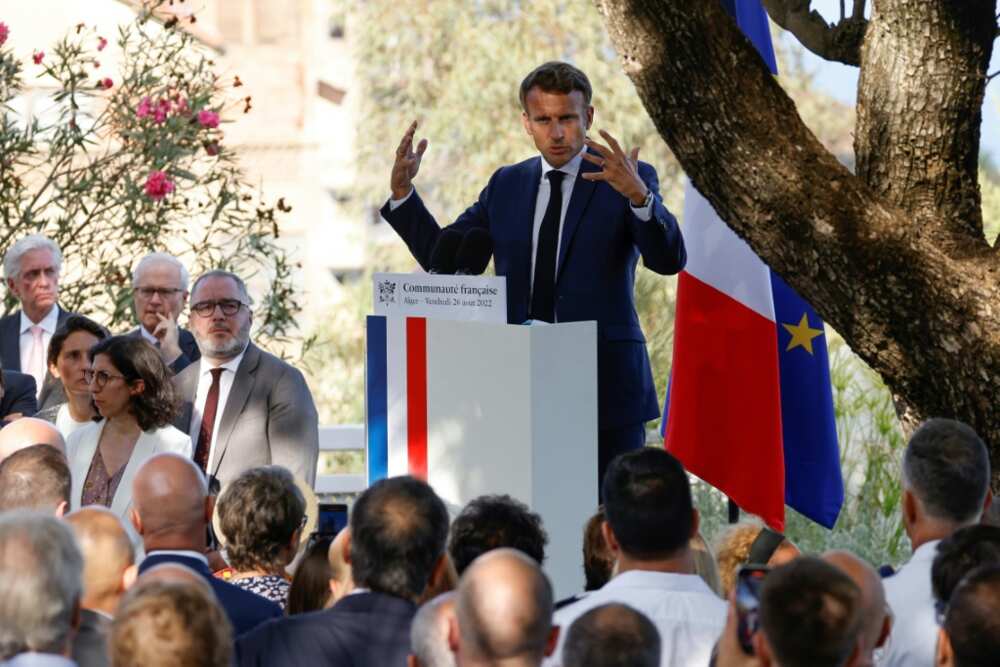 French President Emmanuel Macron delivers a speech during a meeting with members of the French community at the French ambassador to Algeria's residence