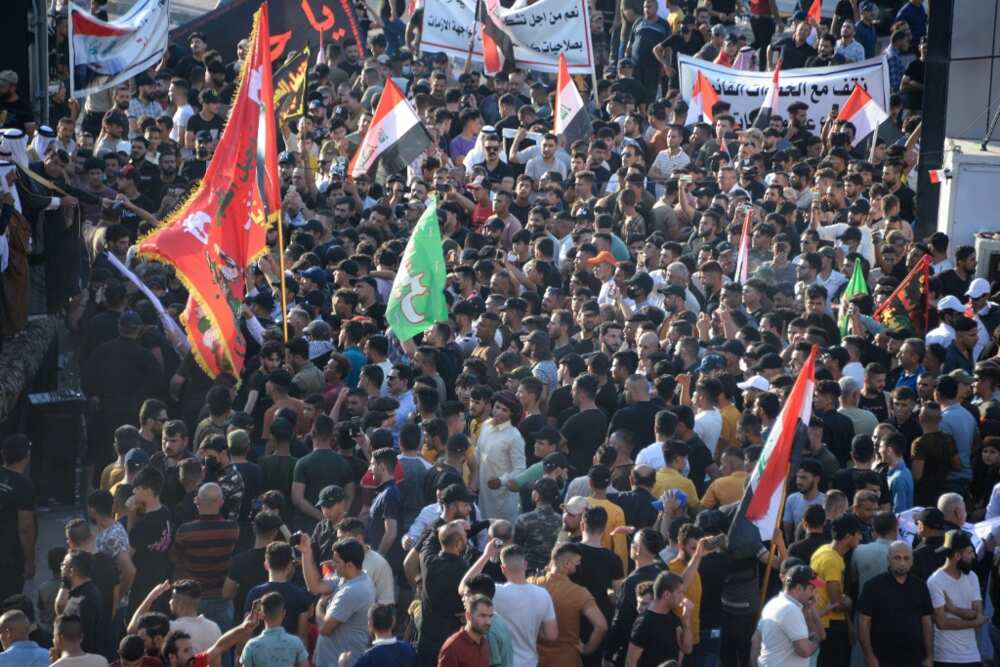 Supporters of Iraq's Coordination Framework hold a rally in the northern Iraqi city of Mosul