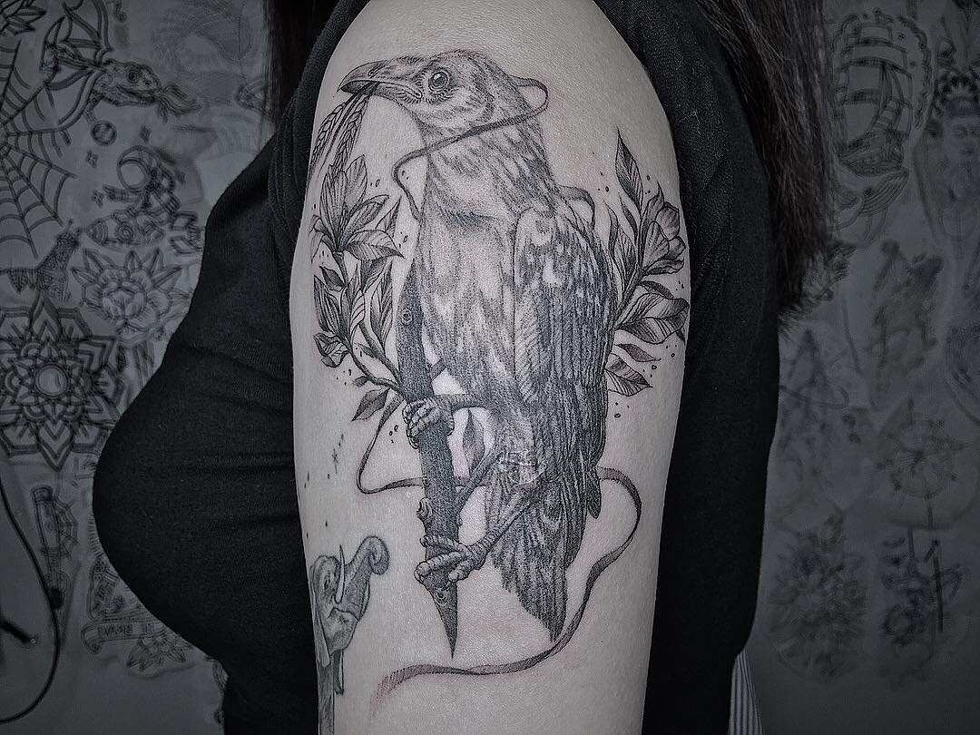 Grey Skull And Black Crow Tattoo On Left Half Sleeve