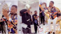 Zubby Michael shows up at E-money's house with bag of money, rains bundles on billionaire ahead of party