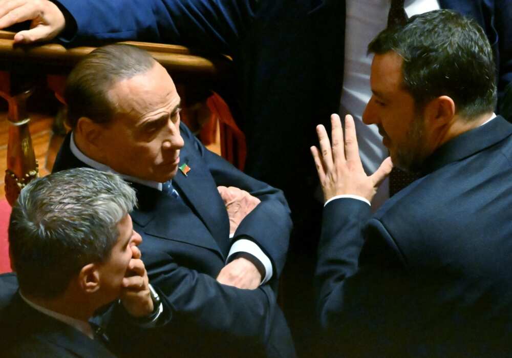 Former premier Silvio Berlusconi (seated) in discussion with the gesticulating  Matteo Salvini, leader of the far-right League