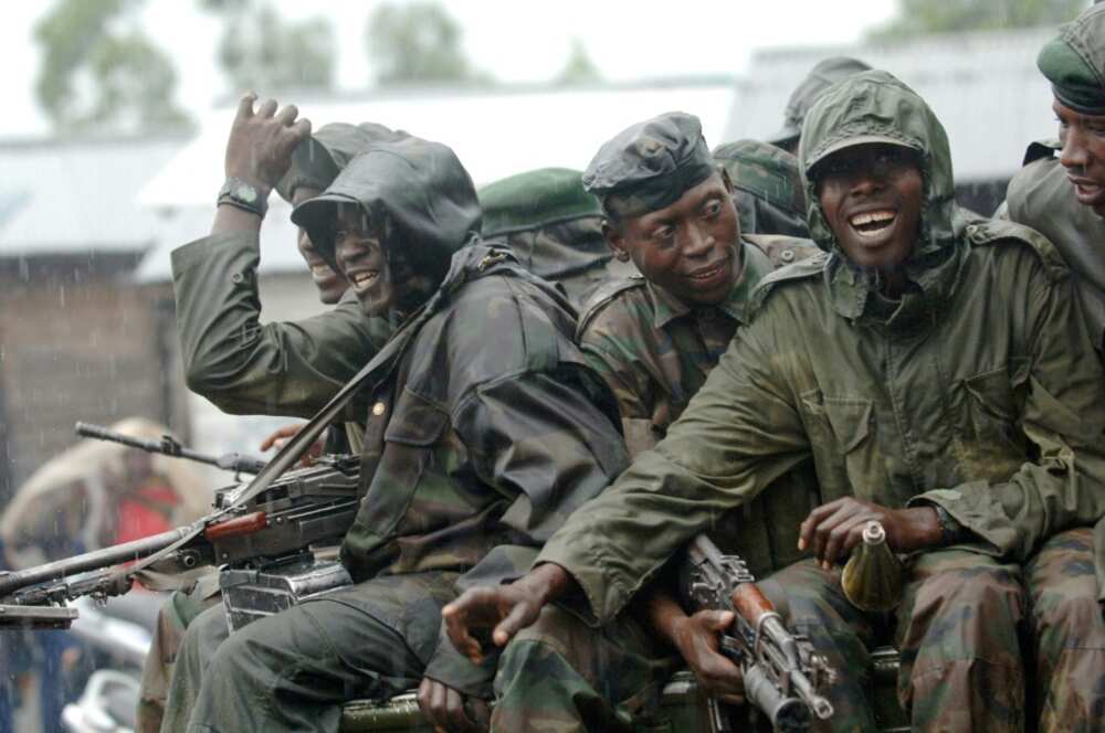 January 2009: CNDP rebels pass through a government checkpoint near Goma on their first step to joining the ranks of the armed forces