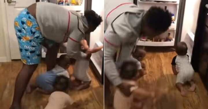 Father stops triplets from entering into fridge