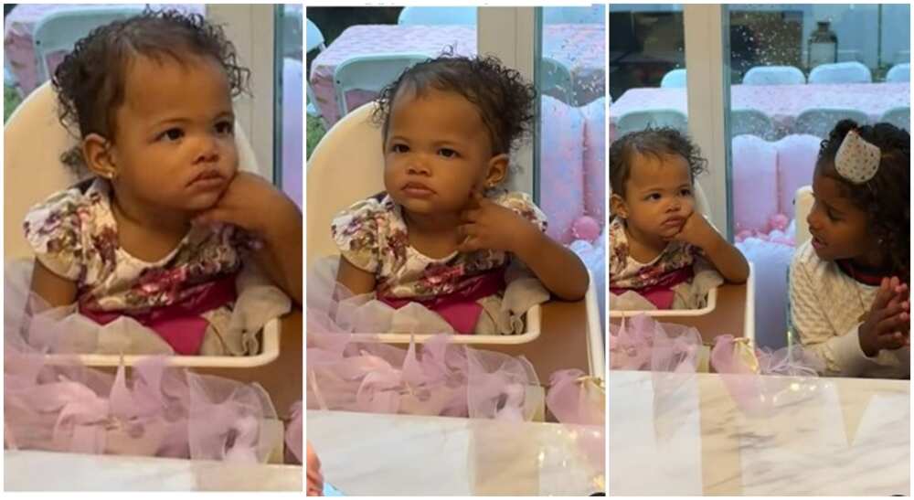Baby girl named Amira keeps straight face as her birthday song is being rendered in video.
