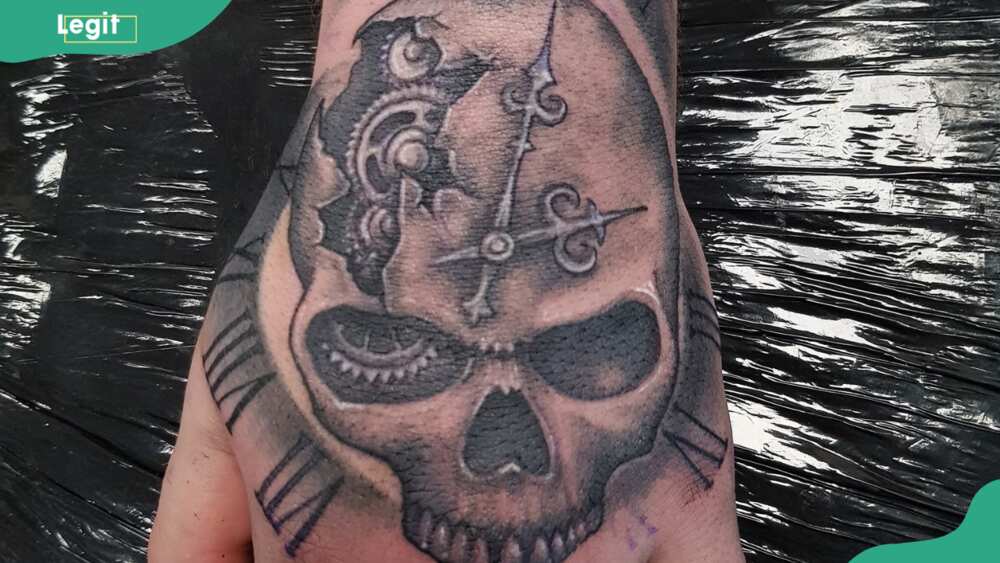 Clock and skull tattoo