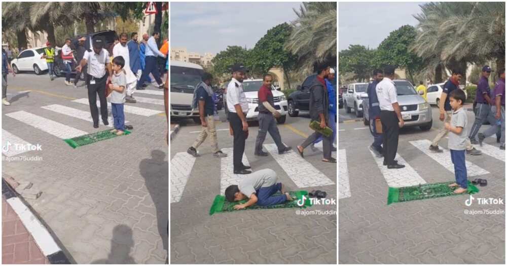 Little boy prays in middle of the road, mat, traffic Little boy prays in middle of the road, mat, traffic