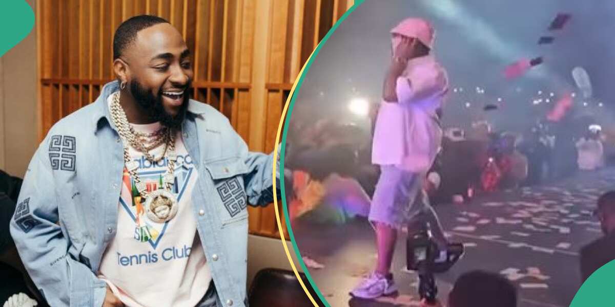 See how Davido reacted towards lady who picked his money on stage during performance (video)