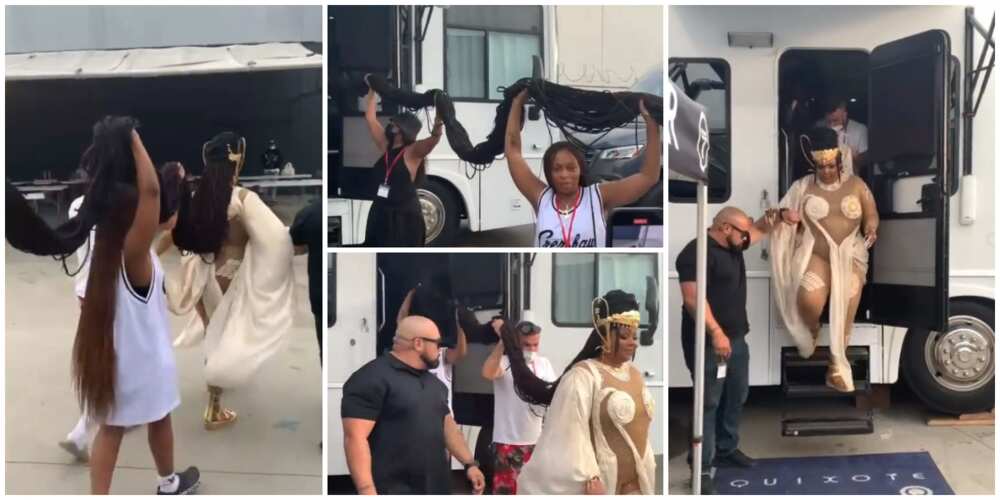 Social media uses react as singer Lizzo steps out in 43 inches long braids that had to be held up by 4 persons as she walked