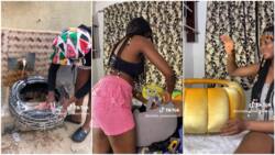 Talented Nigerian lady recycles old car tyre into centre table, shows people how she did it in video