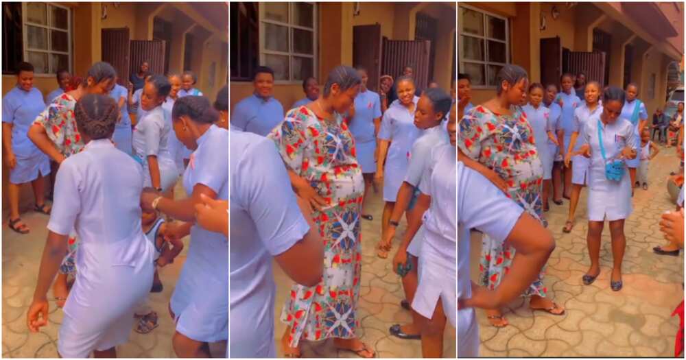 Over 15 nurses happily dance with pregnant lady in hospital compound