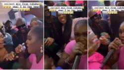 “Try am with Burna”: Video trends as woman drags microphone from 2baba during performance