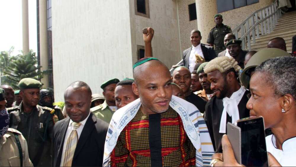 Nnamdi Kanu standing in front of a courtroom