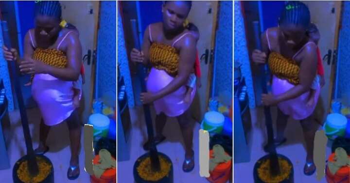 Pregnant woman pounds 'banga' with baby at her back
