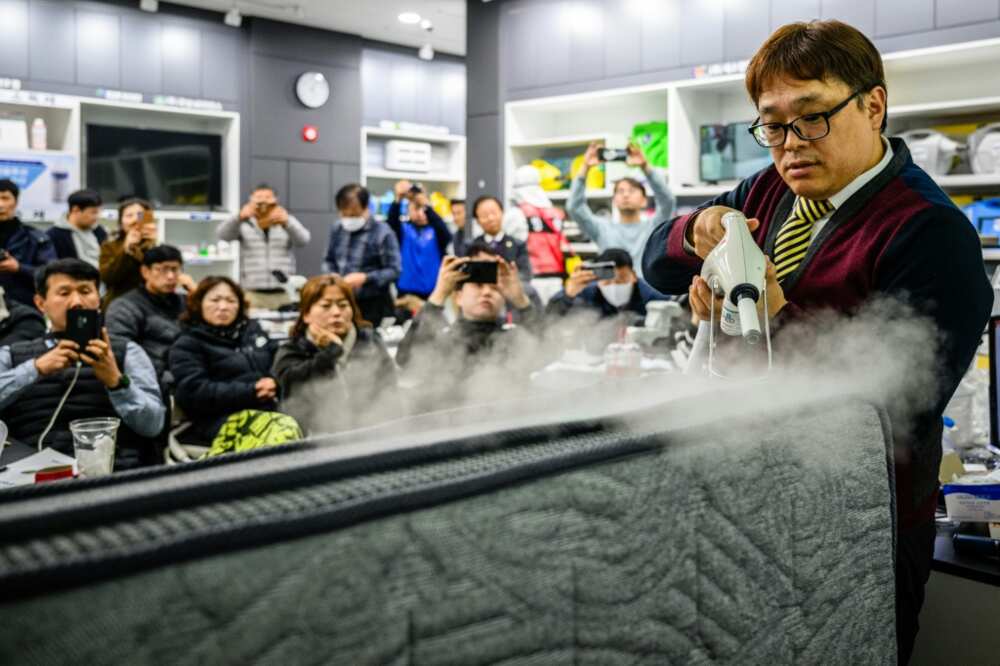 Jang Young-jin, CEO of pest control company Bugs Clean, demonstrates how to treat a mattress affected by bedbugs