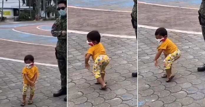 Little boy whines, soldier