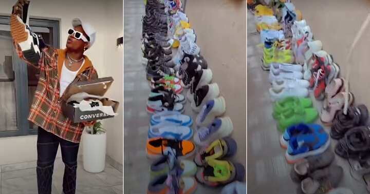 Man shows off collection of shoes