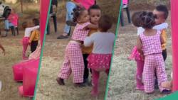 "Fighting over a boy in diapers": Funny video of little girls struggling to hug male friend trends