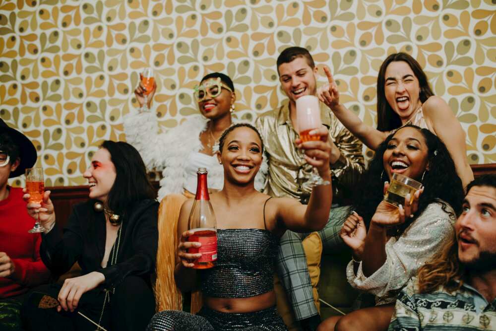 A group of people enjoying drinks at a party