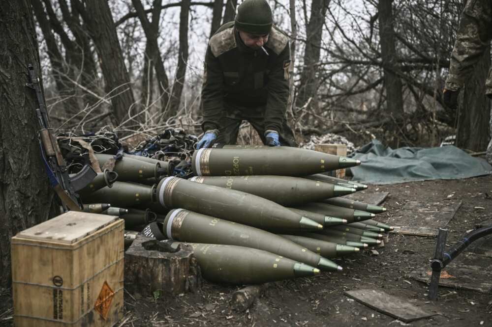 A Ukrainian serviceman preparing 155mm artillery shells near Bakhmut, eastern Ukraine. Kyiv has complained its forces are having to ration their firepower