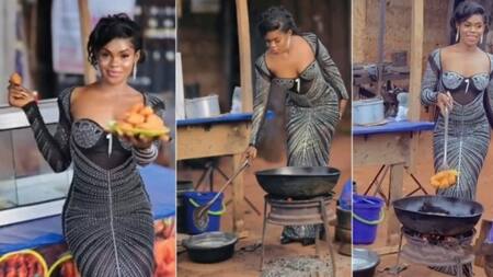 "This akara go cost o": Slay queen wears hot gown to sell bean cake by roadside, video stuns many