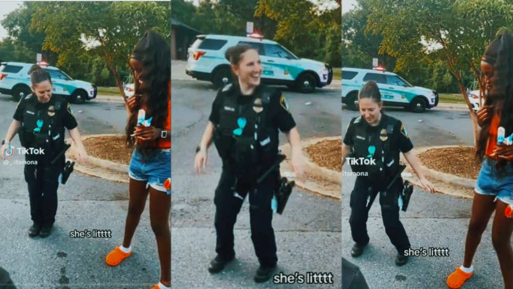 Black lady dance with Oyinbo police woman