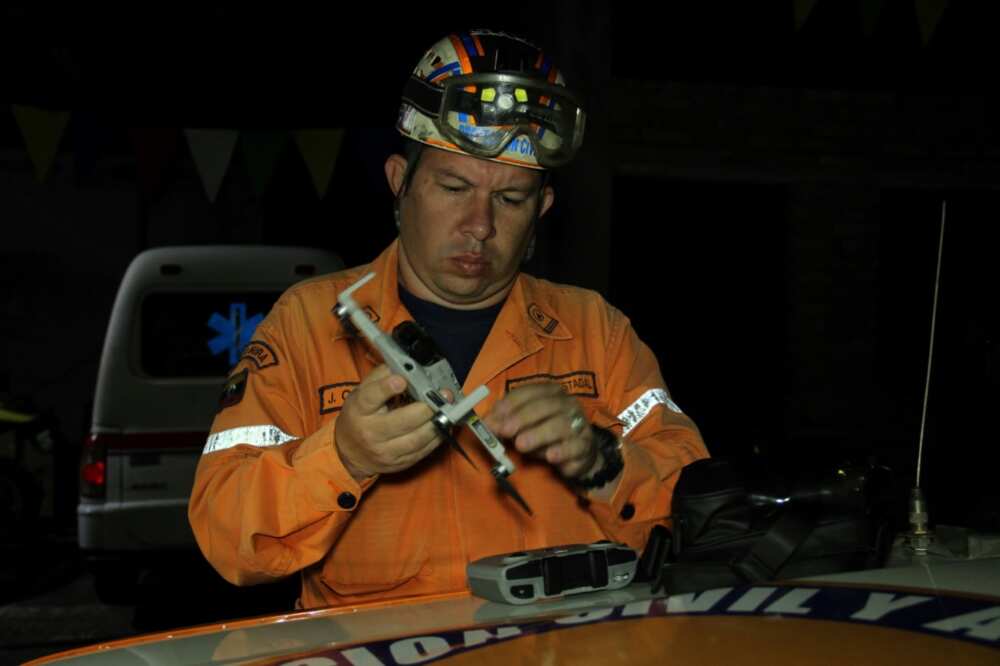 A member of Civil Protection, part of a group of rescuers, prepares a drone that will be used in a search and rescue operation for members of a religious group who remain missing in San Cristobal, Tachira state, Venezuela, on September 6, 2022 A member of Civil Protection, part of a group of rescuers, prepares a drone that will be used in a search and rescue operation for members of a religious group who remain missing in San Cristobal, Tachira state, Venezuela, on September 6, 2022