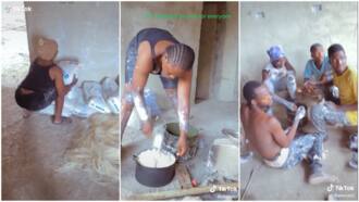 Lady works at construction site, cooks rice & stew for her colleagues to eat during break time in video