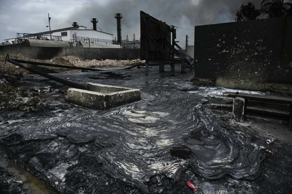 The charred remains of four destroyed fuel tanks at a storage facility in Matanzas, Cuba