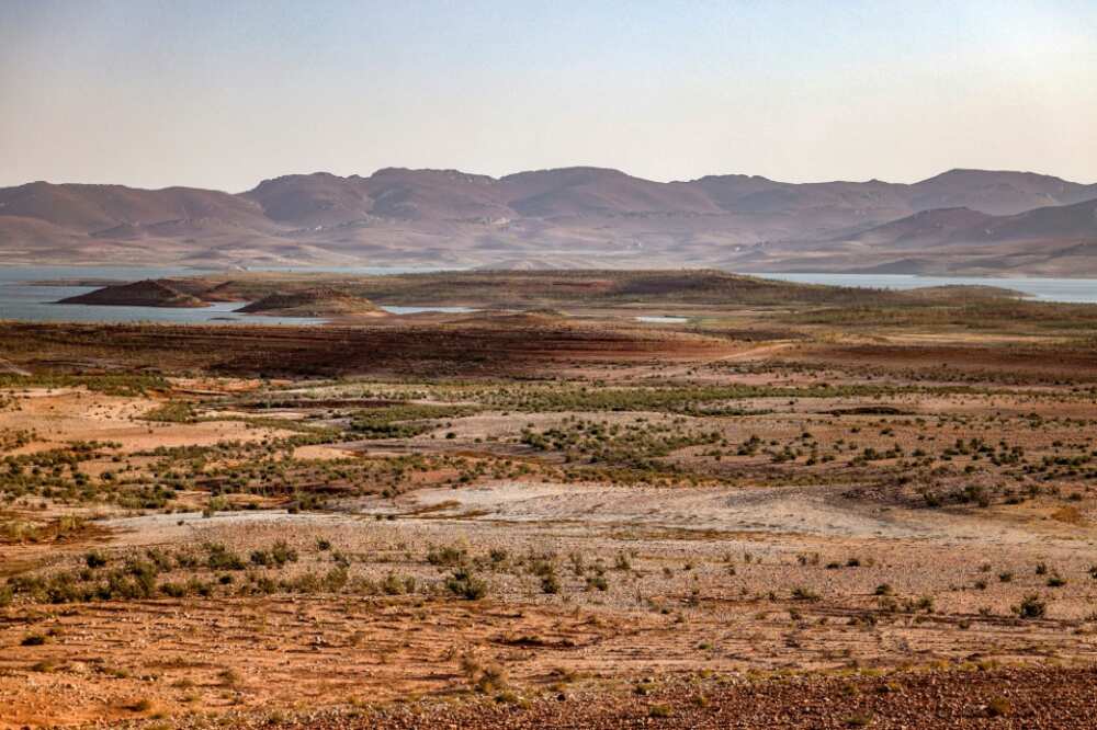 Dry landscape circles Al Massira Dam, Morocco's second largest