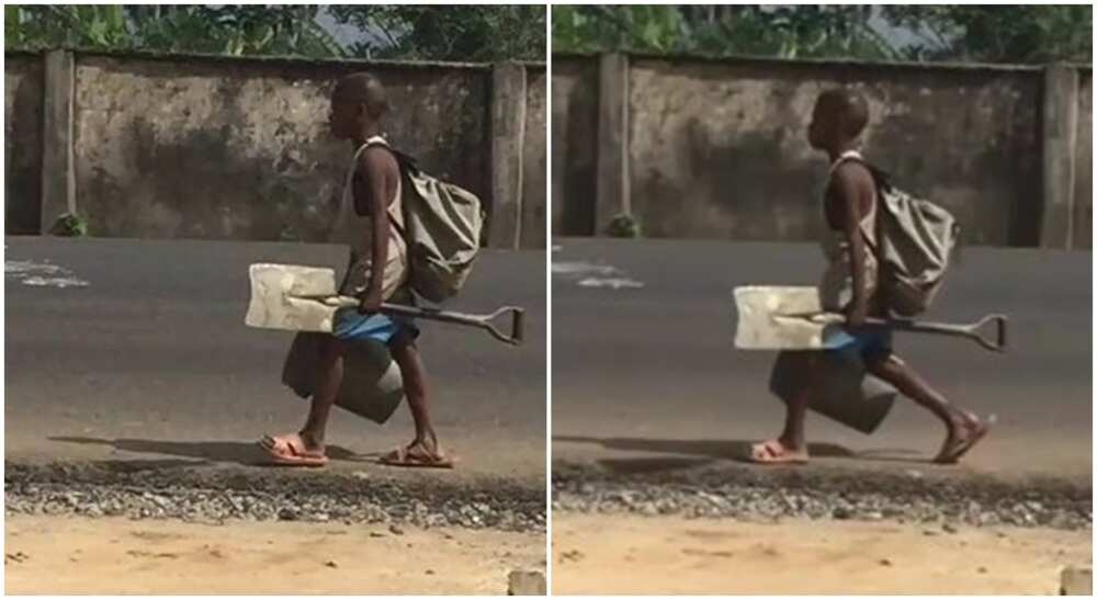Young Nigerian boy seen with work tools.