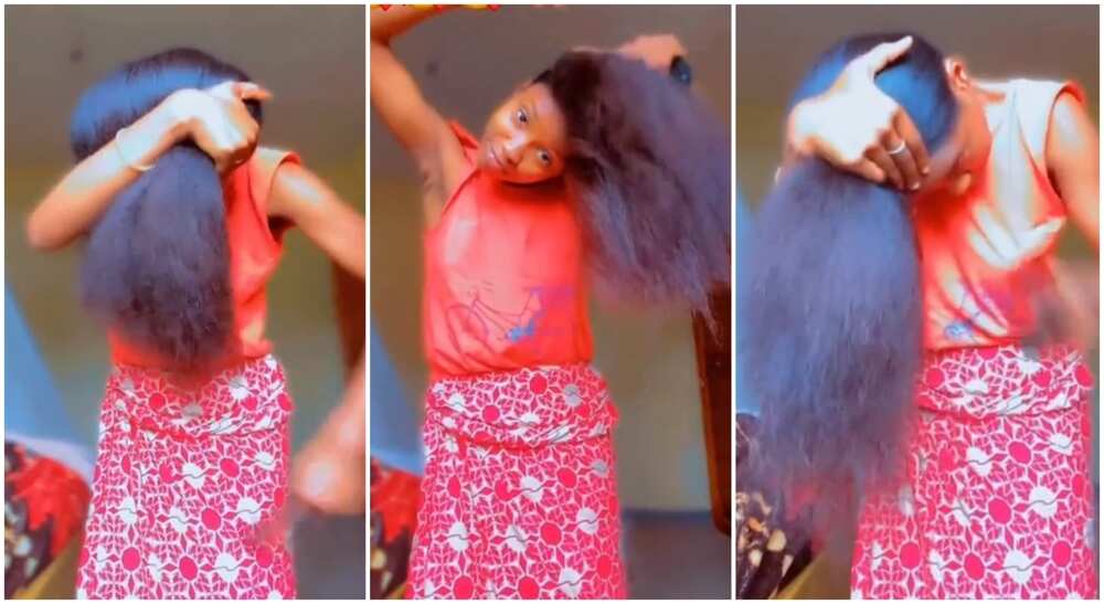 The Nigerian lady blessed with extremely long natural hair combs it out.