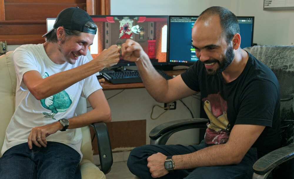 Developers Josuhe Pagliery and David Darias celebrate the release of Cuba's first independent video game