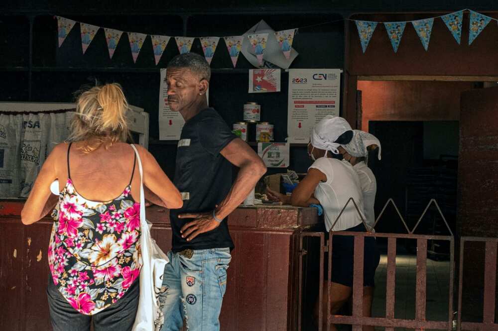 At a privately-run supermarket in Havana, a kilogram of milk powder costs about $14 At a privately-run supermarket in Havana, a kilogram of milk powder costs about $14