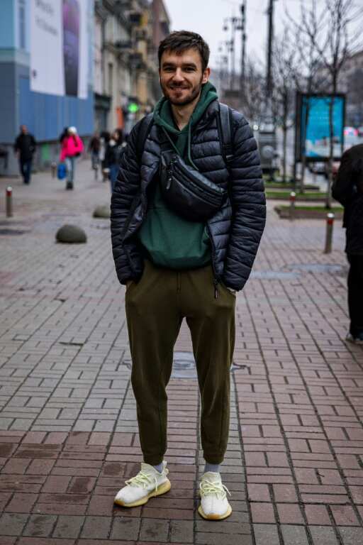 Igor, 26, poses in Kyiv in garb in keeping with the times and to match a trend set by his president