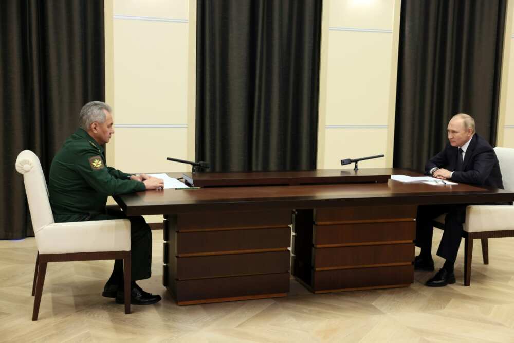 Russian President Vladimir Putin meets with Defence Minister Sergei Shoigu on October 28