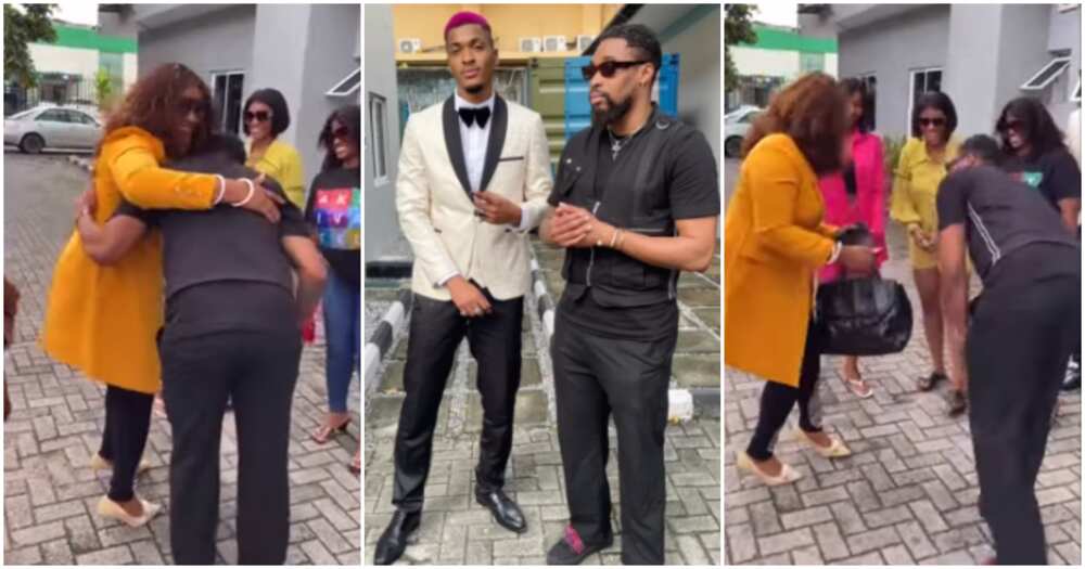 BBNaija star Sheggz prostrates to greet Groovy's mum.