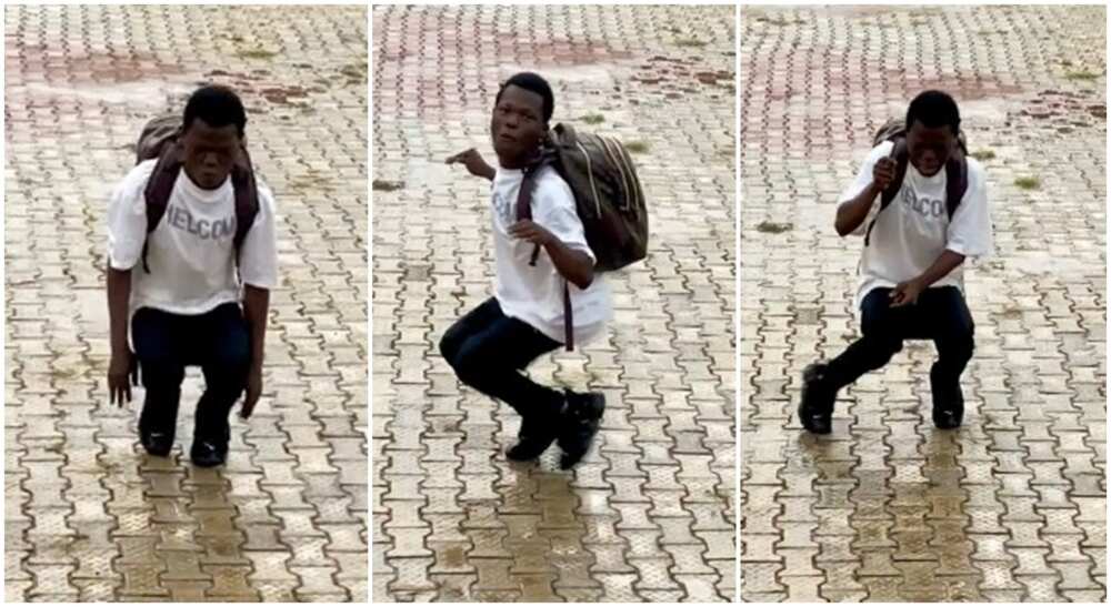 Nigerian man dances while squatting.